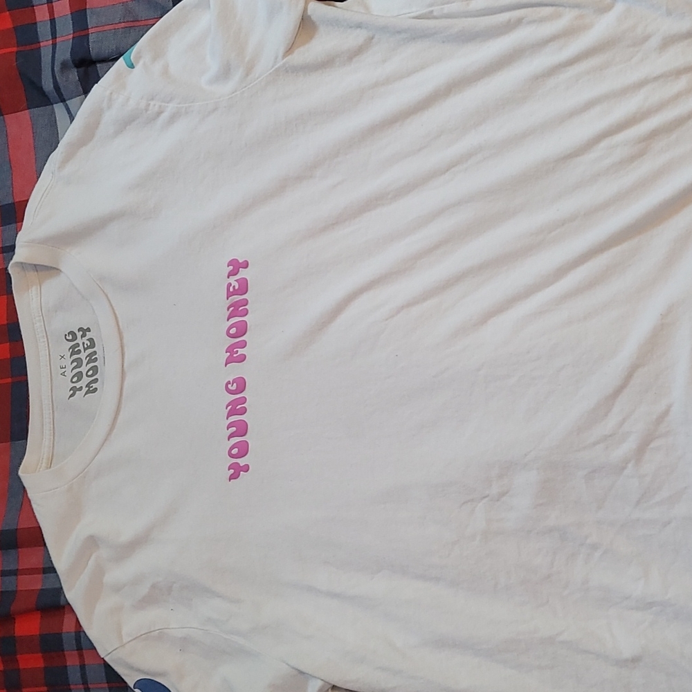 A White "American Eagle" Long Sleeve Shirt. Designs all around the shirt.